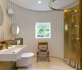 Bath Room, Metal Counter, Wall Mount Sink, Open Shower, Recessed Lighting, and One Piece Toilet  Photo 11 of 14 in Birkedal Vacation Rental by Dwell from Stay in This Danish Vacation Home Made Up of 9 Log-Clad Cylinders