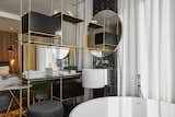 Bath Room, Freestanding Tub, Wall Mount Sink, and Soaking Tub  Photo 6 of 15 in Roomers Munich by Dwell from This Munich Hotel Looks Like It's From a James Bond Movie