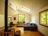 Living Room, Medium Hardwood Floor, Wood Burning Fireplace, Coffee Tables, Sofa, Wall Lighting, and Sectional  Photos from 8 Outstanding Cabins For Rent in Canada