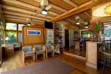 Living Room, Chair, Medium Hardwood Floor, Rug Floor, Stools, Bar, Shelves, and Ceiling Lighting  Photo 9 of 10 in 9 Vacation Rentals That Will Make You Want to Book a Flight to Hawaii