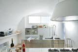 Kitchen, Range, Metal Counter, Metal Cabinet, Undermount Sink, Wall Oven, and Pendant Lighting  Photo 2 of 7 in 7 Design Tips For a Chef-Worthy Kitchen