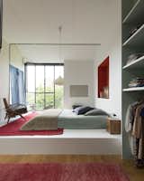 Bedroom, Bed, Chair, Pendant, Night Stands, Wardrobe, and Medium Hardwood  Bedroom Wardrobe Bed Chair Pendant Photos from 8 Charming Parisian Apartments You'll Want to Book Right Now