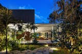 Outdoor, Front Yard, Trees, Walkways, and Hardscapes  Photos from A Concrete Home in Brazil Lets the Owners Practically Live in the Jungle