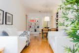 Living Room, Sofa, Pendant Lighting, and Medium Hardwood Floor  Photo 9 of 9 in 8 Marvelous Apartments You Should Absolutely Rent in Milan