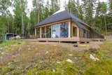 Architect Paolo Caravello of Helsinki-based practice Void created this prism-shaped house near a lake in Sysmä, Finland, with a glass-topped pyramidal roof that transformed the top level of the house into a fully glazed observatory where its owners can look out to stunning views of the nature outdoors.