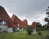 Traditional Kentish hop-drying towers inspired the pyramid-like roof forms of this country estate home, which won its creators—James Macdonald Wright of Macdonald Wright Architects, and Niall Maxwell of Rural Office—the Royal Institute of British Architects’ 2017 "House of the Year" award.