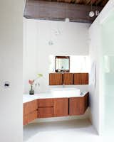 If you have a bathroom with tight corners, follow Omer Arbel Office Inc.'s lead and make good use of tricky nooks to showcase beautiful joinery, like they did for this angular home in a Canadian hayfield.