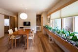 Dining Room, Chair, Pendant Lighting, Table, Recessed Lighting, and Medium Hardwood Floor Dining table from Berkshire wood products, and dining chairs from Allmodern  Photo 12 of 14 in A Super-Insulated Home in Japan Brings Comfort to an Elderly Couple