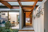 Doors, Exterior, Metal, and Swing Door Type  Photo 1 of 120 in Entry by Casey Tiedman from This Brilliant Brazilian Abode Was Designed Around an Imposing Tree