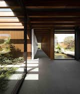 Hallway In this Brazilian home, São Paulo studio Jacobsen Arquitetura placed laminated timber porticoes approximately 1.31 feet apart, to create a dynamic linear aesthetics that brings to mind the tori gates of Kyoto’s famous Fushimi Inari shrine.  Search “출장샵［Talk:Za31］부산출장만남출장사이트” from 10 Zen Homes That Champion Japanese Design