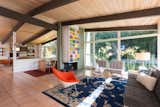 Living, Sofa, Corner, End Tables, Terra-cotta Tile, Wood Burning, Chair, Ceiling, Rug, Table, Coffee Tables, and Lamps  Living Sofa Corner Lamps Photos from An Immaculate Midcentury Abode in San Diego Asks $1.55M