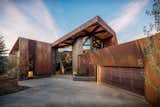 Exterior, Metal Roof Material, Metal Siding Material, Stone Siding Material, Glass Siding Material, and House Building Type  Photo 6 of 40 in Garage / Carport by Casey Tiedman from An Angular Mountain Retreat in Colorado Captures Breathtaking Views