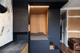 A "space cube" made of Fenix NTM's matte nanotech material and warm oak serves as a sleeping nook and storage.