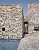 Exterior, House Building Type, Flat RoofLine, and Stone Siding Material Villa DL has small roofless courtyards, and central patio reminiscent of the types found in ancestral farmsteads in the nearby countryside.  Photos from 4 Enchanting Moroccan Villas by French Duo Studio KO