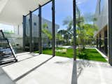 Hallway This holiday retreat in Cairns, Australia has eight-meter high full-height glass windows, and a 59-foot long lap pool.  Photo 6 of 8 in 8 Glass Houses You Can Rent Right Now