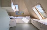 Bedroom, Bunks, Storage, and Bed Bunk beds and built-in storage in the attic.  Search “bedroomfurniture--bunks” from A Tent-Shaped Home in the Netherlands Crouches Between Natural Dunes