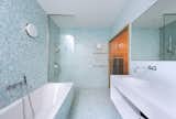 A cheerful, blue, tiled bathroom