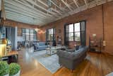 This vacation apartment in Dallas, Texas, has 17-foot-high ceilings and exposed brick walls.