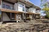 Exterior, Metal Siding Material, Metal Roof Material, Shipping Container Building Type, and Flat RoofLine Small front patios connect the houses to their environment.  Photo 3 of 12 in A Costa Rican Family Stays Connected in Three Shipping Container Homes