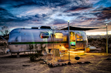 Exterior, Metal, Airstream, Camper, and Curved A trailer at El Cosmico in Marfa, Texas.  Exterior Airstream Camper Photos from 17 Kick-Ass Campers and Trailers You Can Rent From $45 a Night