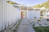 Exterior, Wood Siding Material, House Building Type, and Mid-Century Building Type The entrance to the house.  Photo 2 of 12 in A Meticulously Updated Midcentury in L.A. Asks $1.49M