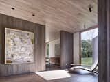 Hallway and Medium Hardwood Floor A George Nakashima chaise in foyer.  Search “bedroomfloors--medium-hardwood”