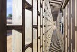 Large openings in the latticework facade brings in warming sunshine and fresh sea breezes.