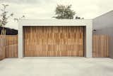 The house is now home to a cedar clad garage door.
