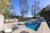 Outdoor, Small, Large, Grass, Back Yard, Trees, Hot Tub, and Plunge An outdoor kitchen, green lawn and pool makes the rear-yard the perfect spot of outdoor soirees.  Outdoor Small Grass Hot Tub Trees Photos from Red Hot Chili Peppers Frontman Anthony Kiedis' Former L.A. Abode Asks $3.2M