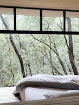 A peek at one of the bedrooms that looks out to the tree tops.