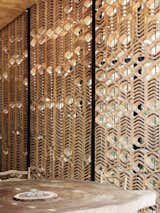 A terracotta, latticework screen brings interesting light and shadow play into the living areas.