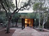 Mirrored glass allows this holiday home in Mexico to blend in with it's woodland site.