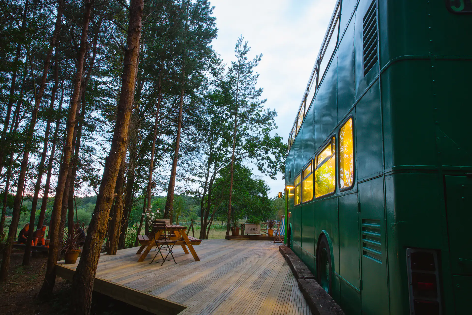 The bus stays "parked" in a peaceful wooded site in the Sussex countryside.