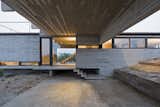 Garage The varied heights of the volumes create interesting interior perspectives.  Search “Garage” from This Stacked Concrete Home Is Not Your Typical Golf Course Dwelling