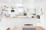 Kitchen, White Cabinet, Cooktops, Track Lighting, Range Hood, Drop In Sink, Wall Oven, and Open Cabinet A skylight brightens to kitchen.  Photo 4 of 13 in Relax and Recharge at This Charming Norwegian "Hytte" Rental