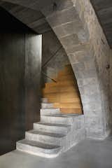 Staircase, Stone Tread, and Wood Tread The entranceway with a stairs that leads to the apartment.  Photos from A Spanish Architect Transforms a Medieval Townhouse Into a Stunning Rental