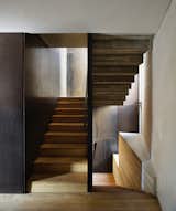 The staircase that leads from the ground-level apartment to the duplex.