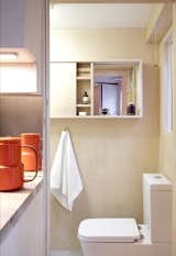 The bathroom, which is located behind the kitchen, is the only space that's separated by a wall.