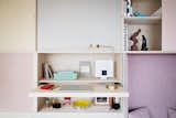Office, Study Room Type, Bookcase, Lamps, Shelves, and Desk Technical equipment below is hidden below this furniture unit.  Photo 5 of 15 in This Tiny 140-Square-Foot Apartment Boasts Comfort and Function