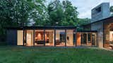 Exterior, House Building Type, Wood Siding Material, Glass Siding Material, Flat RoofLine, Metal Roof Material, and Metal Siding Material The secluded site allows for a high level of transparency in the design.  Photos from This Glass House and "Shiny Shed" Merge With Nature in Minnesota