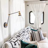 Living Room, Sofa, and Wall Lighting LNC Plug-in Wall Lamp with swing arm from World Market.  Photo 8 of 16 in Hit the Road With This Chic Camper on Sale For $28K