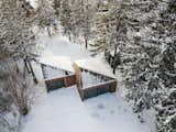 The pyramidal roofs of the cabins allow snow to slide down to the ground.
