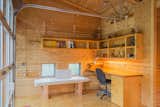 Office, Chair, Desk, Plywood, Lamps, and Craft Room The workshop in the bunkhouse.  Office Craft Room Chair Lamps Plywood Photos from Own This Award-Winning Riverside Home in Idaho For $650K