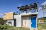 Shed & Studio, Living Space Room Type, and Storage Space Room Type A smaller, rectangular building between the two blocks that's equipped for surfing-related activities.  Photos from A Concrete Abode Becomes a Surfer's Paradise