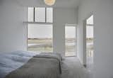 The lake-facing outdoor terrace can be accessed through the bedroom.