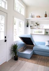 An IKEA sofa bed with hidden storage, that fits snugly against the wall. 