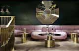 Inspired by Sea Containers House—a landmark building on the south bank of the River Thames—the bar is furnished with leather banquettes in cool lavender shades, velour lounge chairs, mirrored tables, and gold and brass accents.