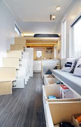 Storage is cleverly located throughout the house, including under the bench in the living room.