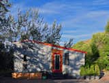 Exterior, Tiny Home, Metal, Metal, Shed, and Shed Corrugated metal siding on the front of the house.  Exterior Shed Tiny Home Metal Photos from See How This Couple Built Their Mobile Tiny Home For Just $30K