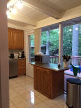 Before: The kitchen had 1980s-style oak cabinets and other dated finishes, and the layout wasn’t functional with a little-used island.